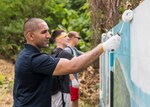 KOTA KINABALU, Malaysia (Feb. 25, 2019) – 1st Lt. Omer Rafiq, from Southbridge, Mass., with 31st Marine Expeditionary Unit (MEU) paints a section of a wall at the Sekolah Menengah Kebangsaan Inanam High School during a cultural exchange and community service event.