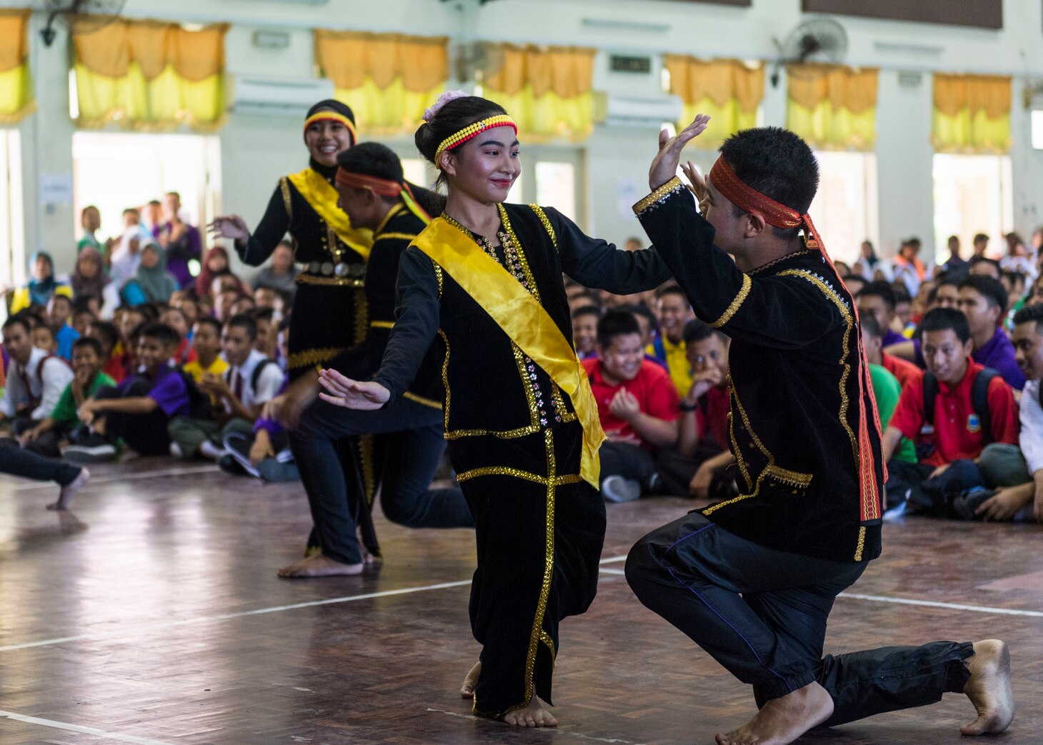 190225-N-WI365-1229 KOTA KINABALU, Malaysia (Feb. 25, 2019) – Students from the Sekolah Menengah Kebangsaan Inanam High School perform a traditional Malaysian dance during a cultural exchange and community service event.