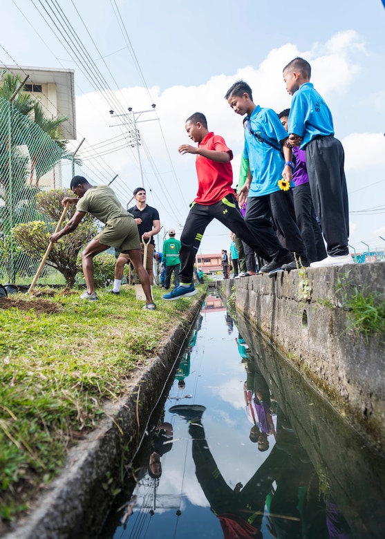 KOTA KINABALU, Malaysia (Feb. 25, 2019) – Sailors assigned to the amphibious dock landing ship USS Ashland (LSD 48) and Marines with 31st Marine Expeditionary Unit (MEU) plant trees at the Sekolah Menengah Kebangsaan Inanam High School during a cultural exchange and community service event.