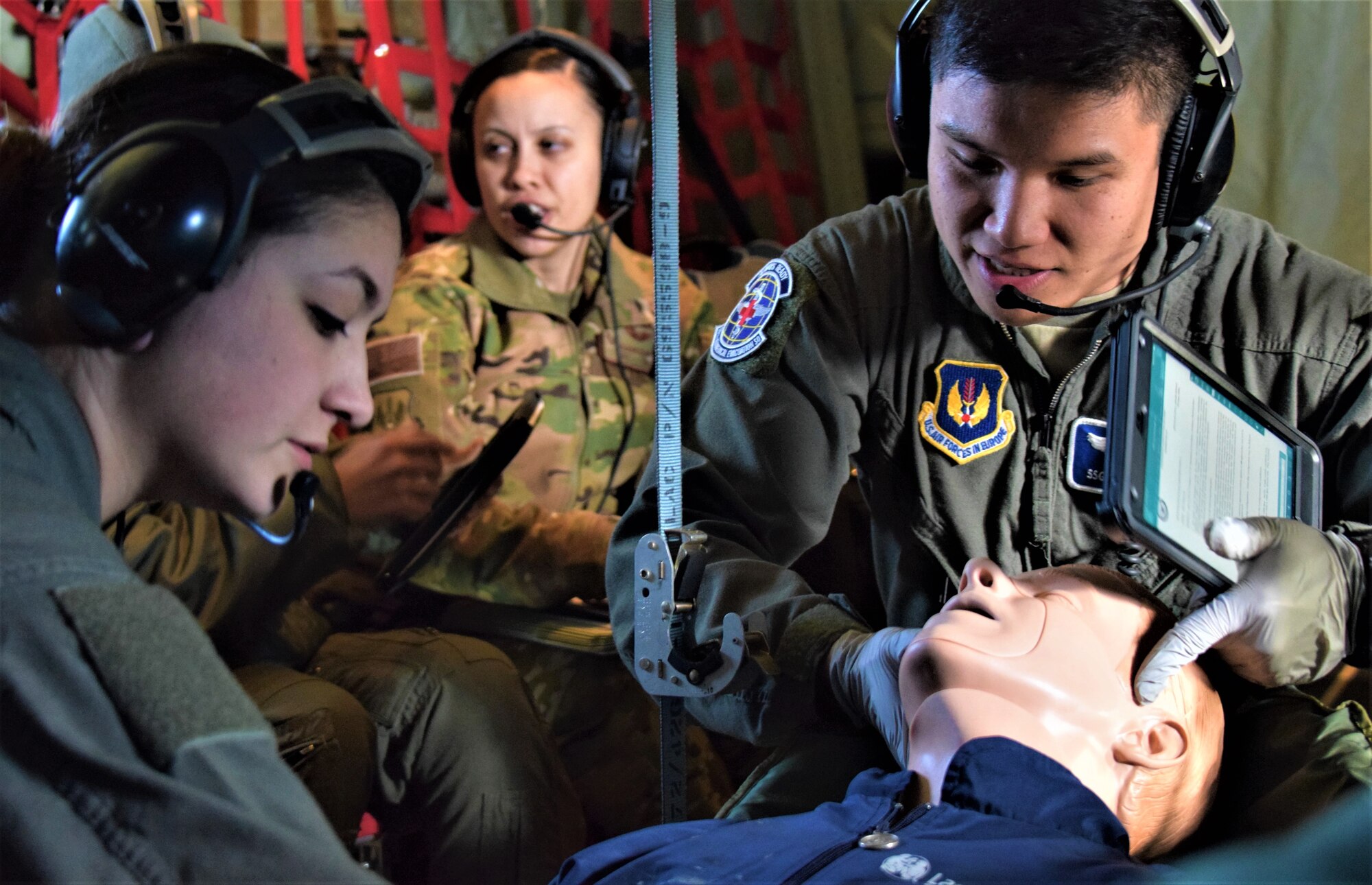 U.S. Air Force Senior Airman Dalila Allen, left, and Staff Sgt. Ryan Gomez, aeromedical evacuation technicians assigned to the 86th Aeromedical Evacuation Squadron, Ramstein Air Base, Germany, participate in an aeromedical readiness mission to Tallinn, Estonia, Feb. 23, 2019. The mission enabled training for semi-annual professional requirements and student upgrades, and simulated the challenges of logistics, alerting procedures, and storing and charging medical equipment at an unfamiliar location. (U.S. Air Force photo by 1st Lt. Andrew Layton)