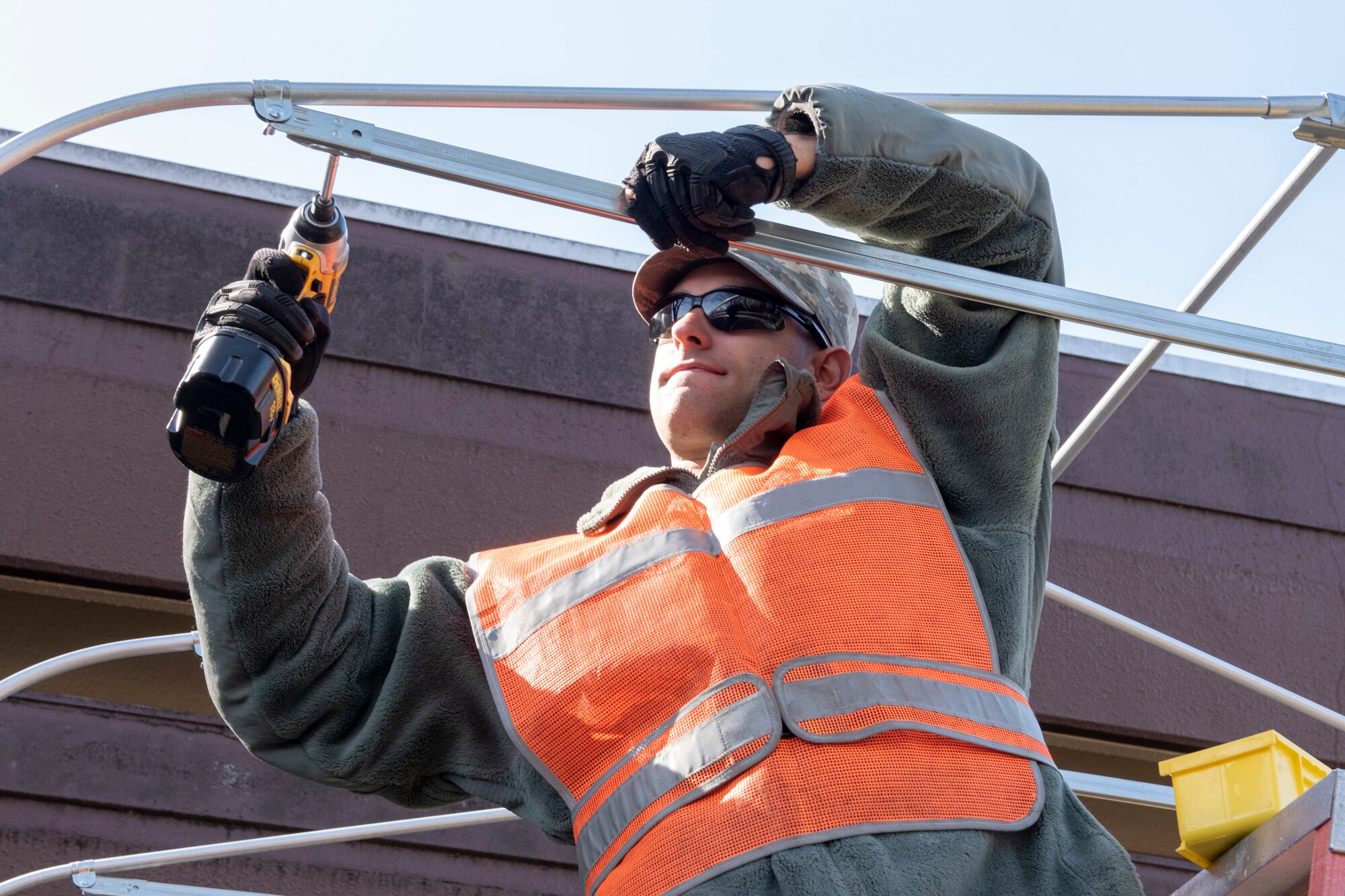 Airman 1st Class William Gilson, 374th Civil Engineer Squadron structures journeyman, secures the framework of a constructed corridor at Yokota Air Base, Japan, Feb. 21, 2019.
