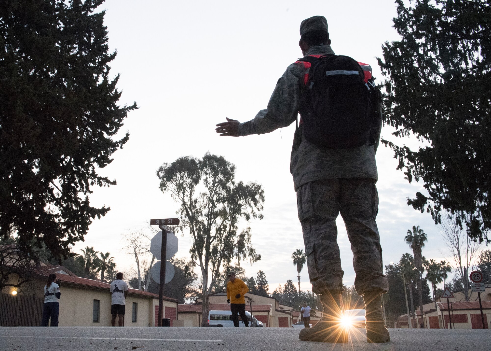 A volunteer directs runners during the Four Chaplains’ Run Feb. 22, 2019, at Incirlik Air Base, Turkey.