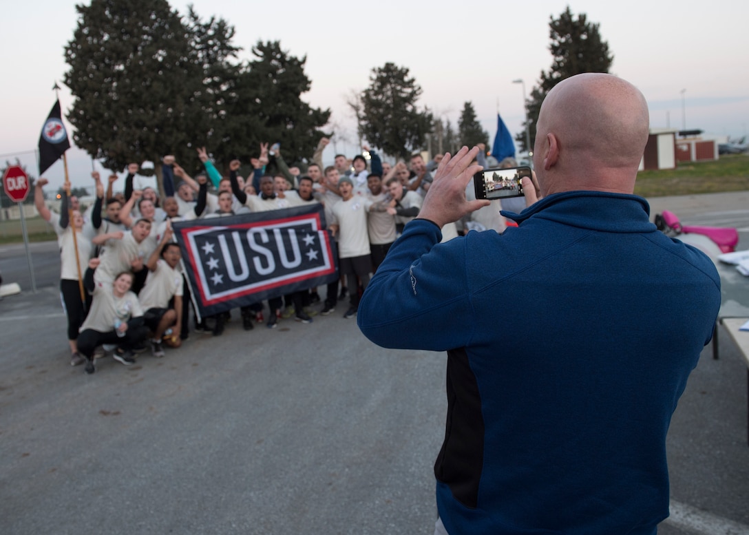 A United Service Organizations’ member takes a photo of Airman Leadership School students and instructors after the Four Chaplains’ Run Feb. 22, 2019, at Incirlik Air Base, Turkey.
