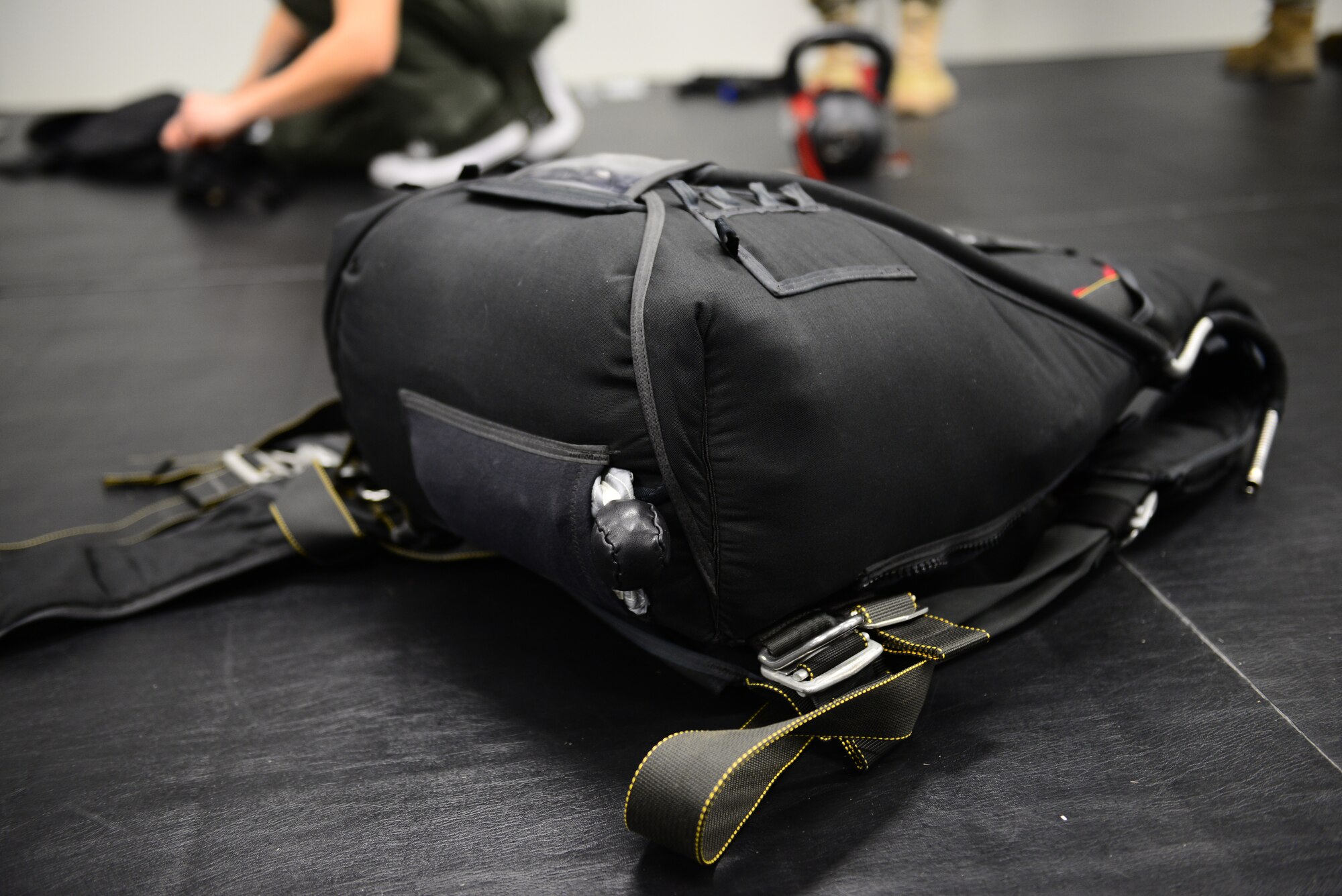 A finished parachute waits to be stored at Aviano Air Base, Italy, Feb. 25, 2019. The 57 RQS Pararescuemen use a variety of parachutes, including this one which has the pilot chute located underneath. (U.S. Air Force photo by Airman 1st Class Caleb House)