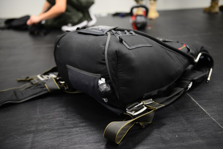 A finished parachute waits to be stored at Aviano Air Base, Italy, Feb. 25, 2019. The 57 RQS Pararescuemen use a variety of parachutes, including this one which has the pilot chute located underneath. (U.S. Air Force photo by Airman 1st Class Caleb House)