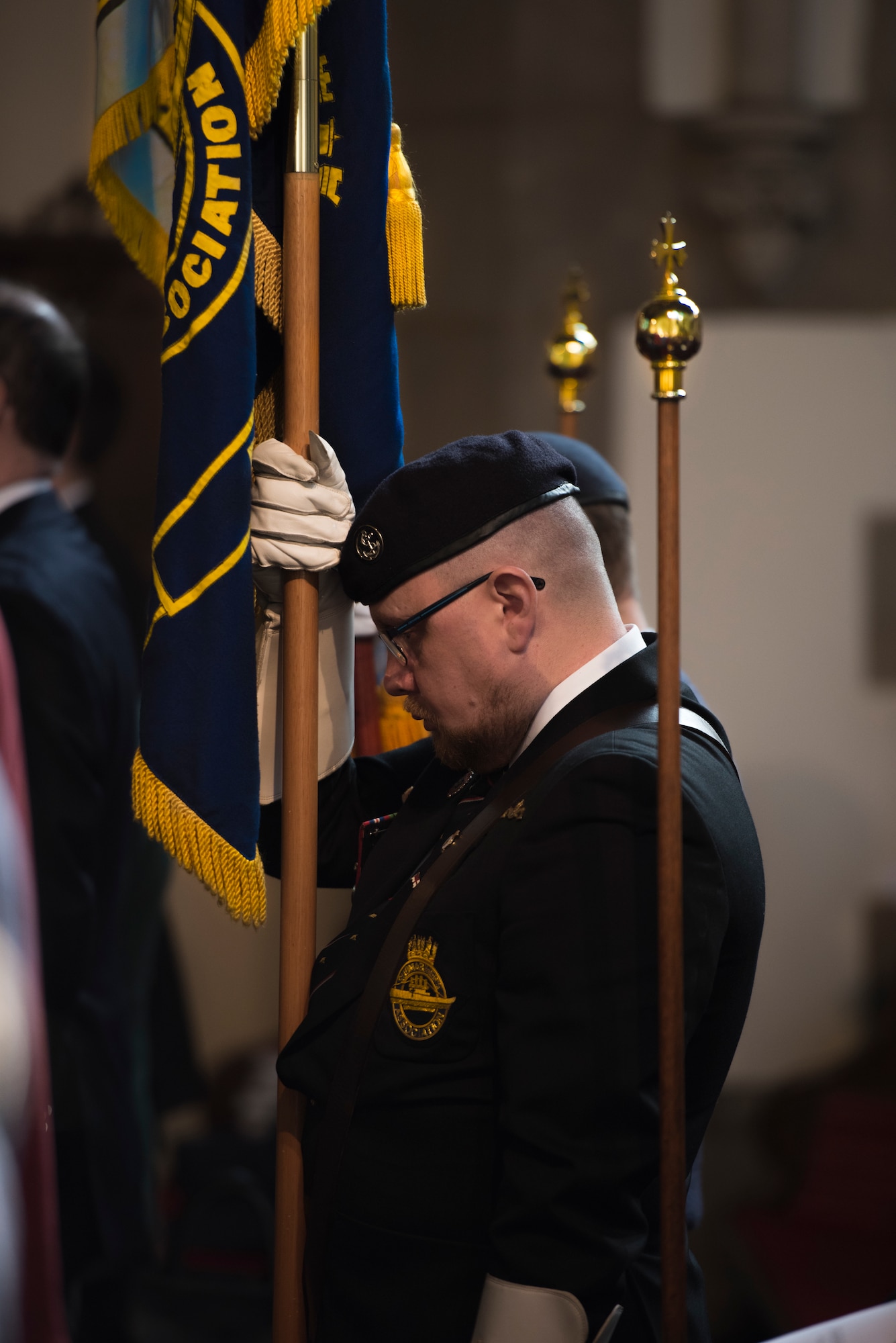 A member of the Royal Air Force Association bows his head during a benediction for the crew of the Mi Amigo in St. Augustine’s Church, Sheffield, United Kingdom, February 24th, 2019. This year’s annual memorial service was accompanied by a United States Air Force and Royal Air Force flypast in Endcliffe Park two days prior, where thousands of U.K. residents honored the memory of ten fallen U.S. Airmen who died when their war-crippled B-17 Flying Fortress crash landed to avoid killing residents and nearby children. (U.S. Air Force photo by Tech Sgt. Aaron Thomasson)