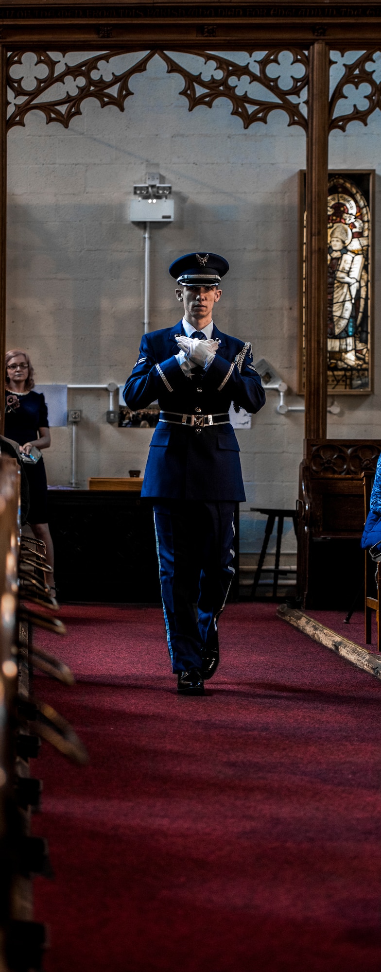 U.S. Air Force Airman First Class Joshua Holsing cradles the American flag while marching down the aisle of St. Augustine’s church in Sheffield, United Kingdom, February 24th. This year’s annual memorial service was accompanied by a United States Air Force and Royal Air Force flypast in Endcliffe Park two days prior, where thousands of U.K. residents honored the memory of ten fallen U.S. Airmen who died when their war-crippled B-17 Flying Fortress crash landed to avoid killing residents and nearby children. (U.S. Air Force photo by Tech Sgt. Aaron Thomasson)
