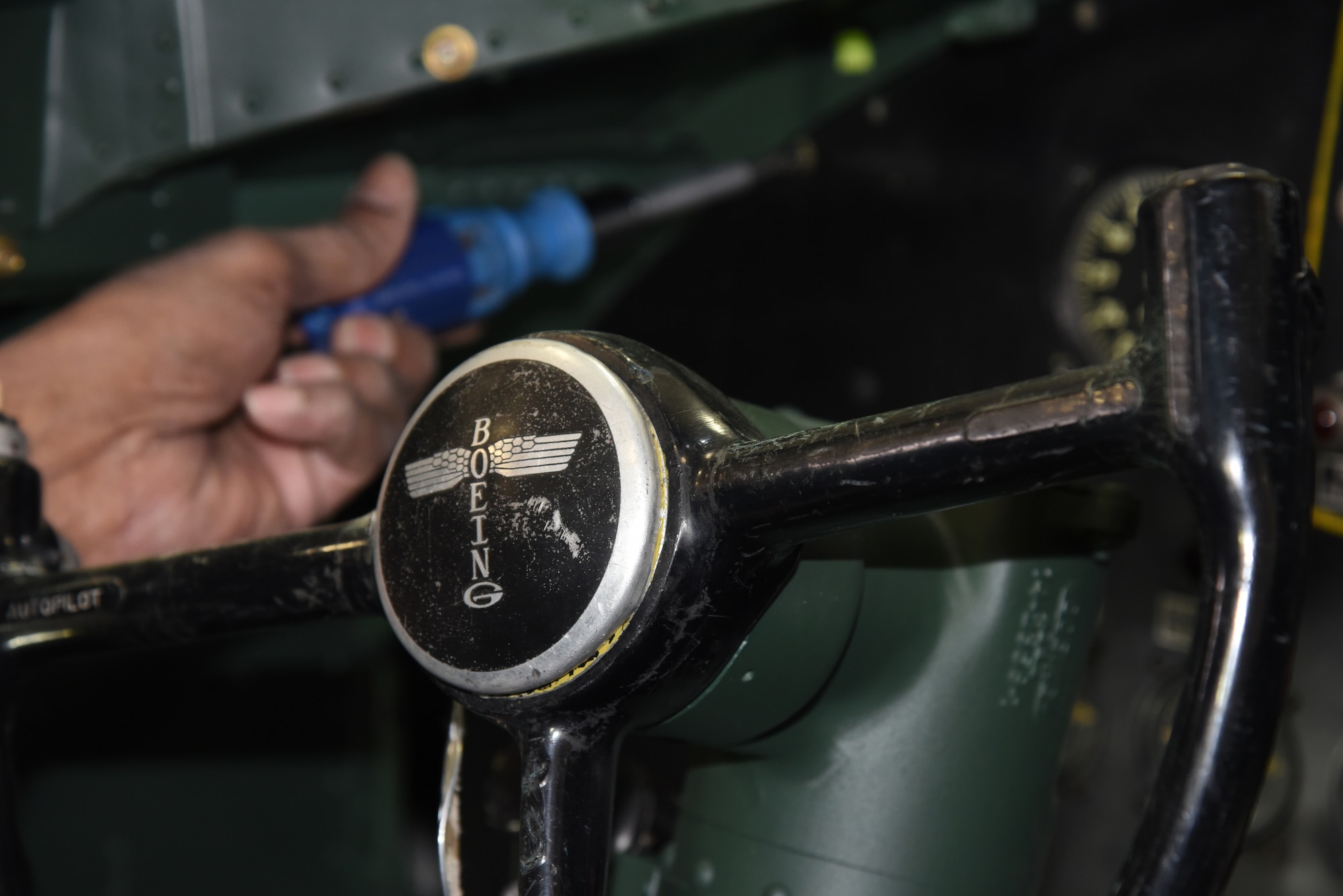 DAYTON, Ohio -- National Museum of the U.S. Air Force restoration specialist Dave Robb installs the pilot's instrument panel on the Boeing B-17F Memphis Belle on March 7, 2018. (U.S. Air Force photo by Ken LaRock)