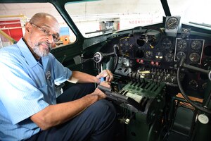 DAYTON, Ohio -- National Museum of the U.S. Air Force restoration specialist Dave Robb installs the pilot's instrument panel on the Boeing B-17F Memphis Belle on March 7, 2018. (U.S. Air Force photo by Ken LaRock)