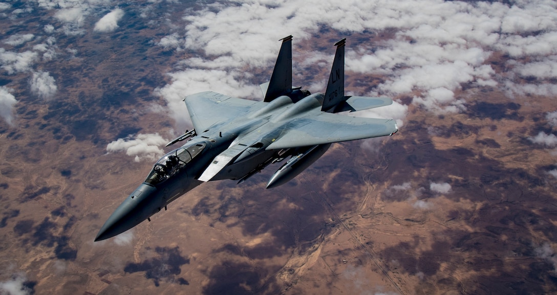 A U.S. F-15 Strike Eagle breaks away after being refueled by a KC-135 Stratotanker from the 28th Expeditionary Air Refueling Squadron Feb. 11, 2019, while flying over Syria. While the United States draws down it's forces in Syria, their air power still remains in the area performing strike missions. U.S. F-15 Strike Eagles are being used as air defense and strike assets to deter Islamic State insurgents from fighting or fleeing. (U.S. Air Force photo/Staff Sgt. Clayton Cupit)