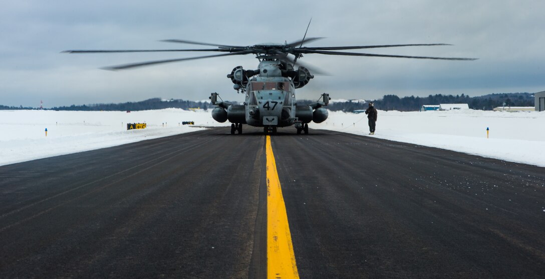 A U.S. Marine Corps CH-53E Super Stallion assigned to HMH-464, Marine Aircraft Group 29, 2nd Marine Aircraft Wing prepares for take-off in Brunswick, Maine, Feb. 15, 2019. Marine Heavy Helicopter Squadron (HMH) 464 is participating in a cold weather training exercise to familiarize and operate in cold weather and other austere environments should the need arise.  (U.S. Marine Corps photo by Cpl. Jered T. Stone)