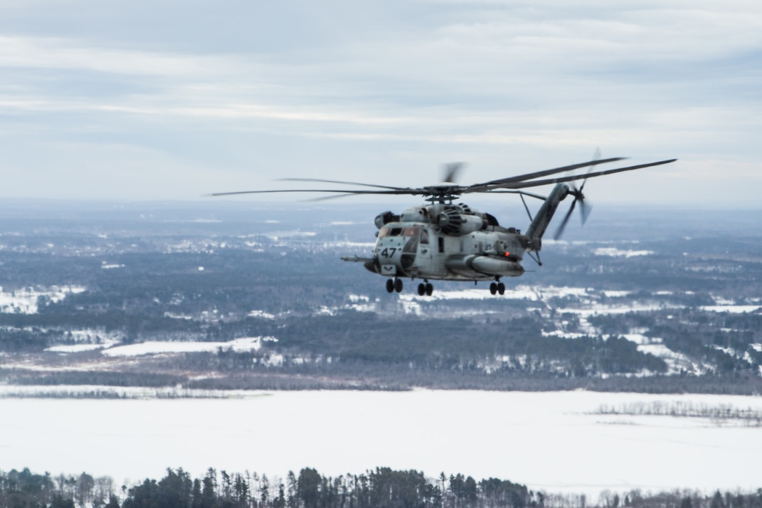 A U.S. Marine Corps CH-53E Super Stallion assigned to HMH-464, Marine Aircraft Group 29, 2nd Marine Aircraft Wing prepares for take-off in Brunswick, Maine, Feb. 15, 2019. Marine Heavy Helicopter Squadron (HMH) 464 is participating in a cold weather training exercise to familiarize and operate in cold weather and other austere environments should the need arise.  (U.S. Marine Corps photo by Cpl. Jered T. Stone)