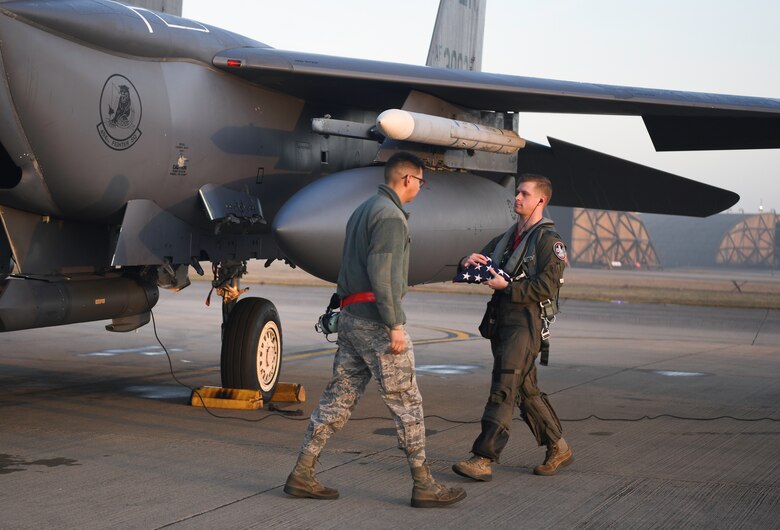 Royal Air Force Lakenheath 494th Fighter Squadron pilots prepare to participate in the MiAmigo 75th anniversary flyover, RAF Lakenheath, England, February 22, 2019. The eight Airmen will fly four F-15E Strike Eagles painted with the names of the men who sacrificed their lives at Endcliffe Park, England in 1944. (U.S. Air Force photo by Airman 1st Class Shanice Williams-Jones)