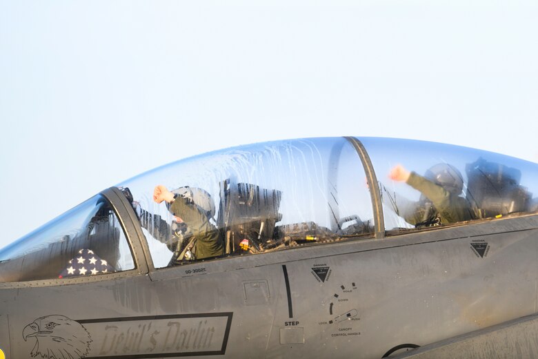 Royal Air Force Lakenheath 494th Fighter Squadron pilots prepare to participate in the MiAmigo 75th anniversary flyover, RAF Lakenheath, England, February 22, 2019. The eight Airmen will fly four F-15E Strike Eagles painted with the names of the men who sacrificed their lives at Endcliffe Park, England in 1944. (U.S. Air Force photo by Airman 1st Class Shanice Williams-Jones)