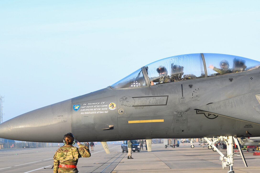 Royal Air Force Lakenheath 494th Fighter Squadron pilots prepare to participate in the MiAmigo 75th anniversary flyover, RAF Lakenheath, England, February 22, 2019. The eight Airmen will fly four F-15E Strike Eagles painted with the names of the men who sacrificed their lives at Endcliffe Park, England in 1944. (U.S. Air Force photo by Airman 1st Class Shanice Williams-Jones)