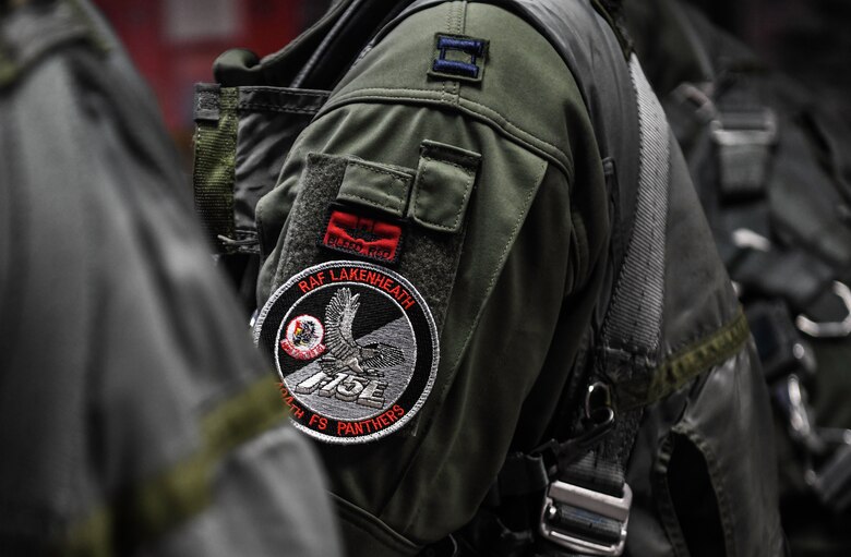 Royal Air Force Lakenheath 494th Fighter Squadron pilots prepare to participate in the MiAmigo 75th anniversary flyover, RAF Lakenheath, England, February 22, 2019. The eight Airmen will fly four F-15E Strike Eagles painted with the names of the men who sacrificed their lives at Endcliffe Park, England in 1944. (U.S. Air Force photo by Airman 1st Class Shanice Williams-Jones)