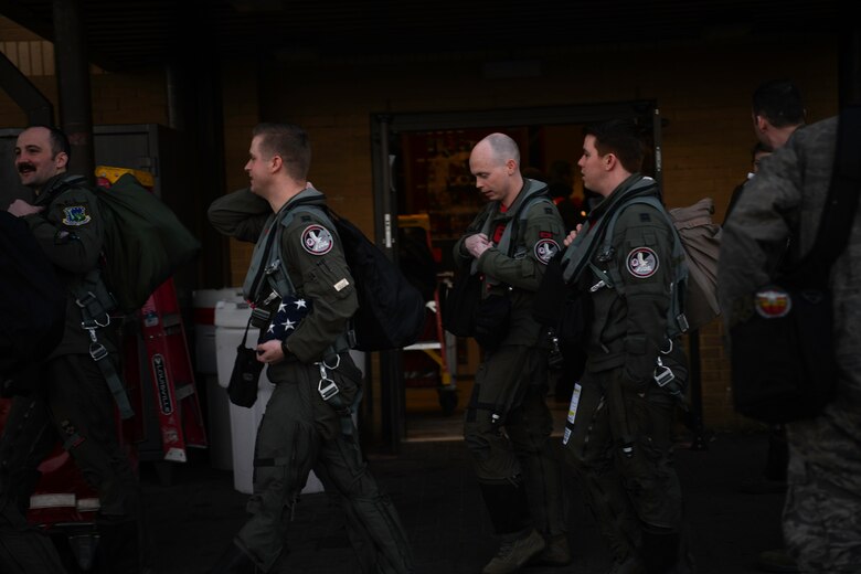 Royal Air Force Lakenheath 494th Fighter Squadron pilots prepare to participate in the MiAmigo 75th anniversary flyover, RAF Lakenheath, England, February 22, 2019. The eight Airmen will fly four F-15E Strike Eagles painted with the names of the men who sacrificed their lives at Endcliffe Park, England in 1944. (U.S. Air Force photo by Airman 1st Class Shanice Williams-Jones)