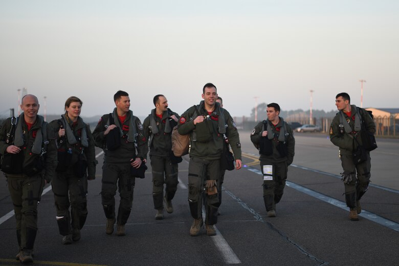 Royal Air Force Lakenheath 494th Fighter Squadron pilots prepare to participate in the MiAmigo 75th anniversary flyover, RAF Lakenheath, England, February 22, 2019. The eight Airmen will fly four F-15E Strike Eagles painted with the names of the men who sacrificed their lives at Endcliffe Park, England in 1944. (U.S. Air Force photo by Airman 1st Class Shanice Williams-Jones)
