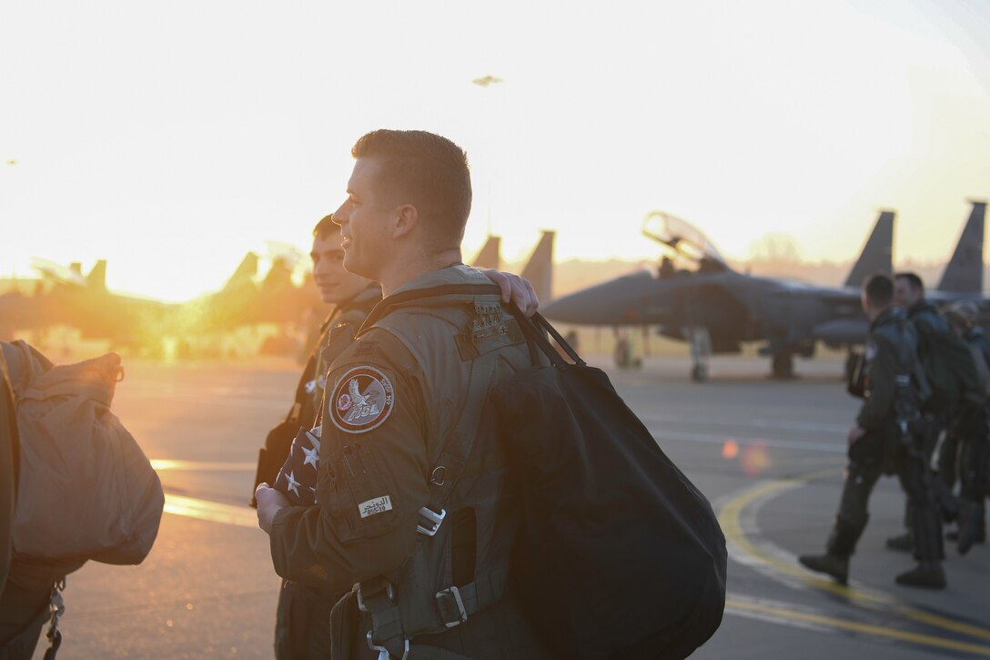 Royal Air Force Lakenheath 494th Fighter Squadron pilots prepare to participate in the MiAmigo 75th anniversary flyover, RAF Lakenheath, England, February 22, 2019. The eight Airmen will fly four F-15E Strike Eagles painted with the names of the men who sacrificed their lives at Endcliffe Park, England in 1944. (U.S. Air Force photo by Airman 1st Class Shanice Williams-Jones)