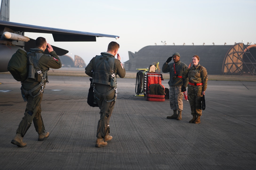 Royal Air Force Lakenheath 494th Fighter Squadron pilots prepare to participate in the MiAmigo 75th anniversary flyover, RAF Lakenheath, England, February 22, 2019. The eight Airmen will fly four F-15E Strike Eagles painted with the names of the men who sacrificed their lives at Endcliffe Park, England in 1944. (U.S. Air Force photo by Airman 1st Class Shanice Williams-Jones)