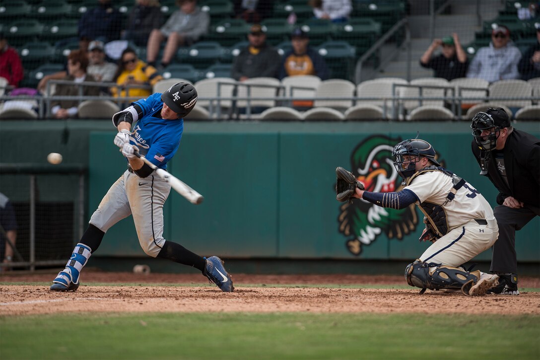 A U.S. Air Force Academy cadet hits a baseball.