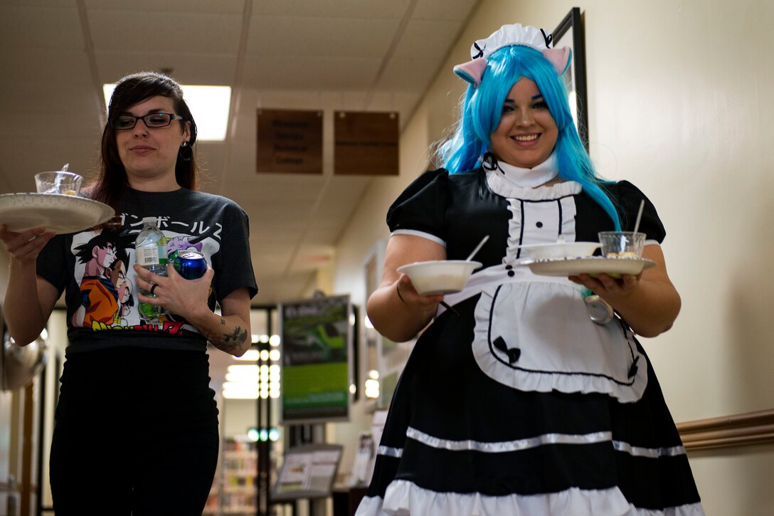 Waitresses bring out food for guests during Cub Con II, a multi-genre entertainment convention, Feb. 23, 2019, at Moody Air Force Base, Ga. At the convention, guests were able to participate in a cosplay contest, an anime music video contest, anime trivia contest and special effects makeup demo. The event served as an opportunity to give Team Moody a chance to experience the anime and comic book culture. (U.S. Air Force photo by Airman 1st Class Erick Requadt)