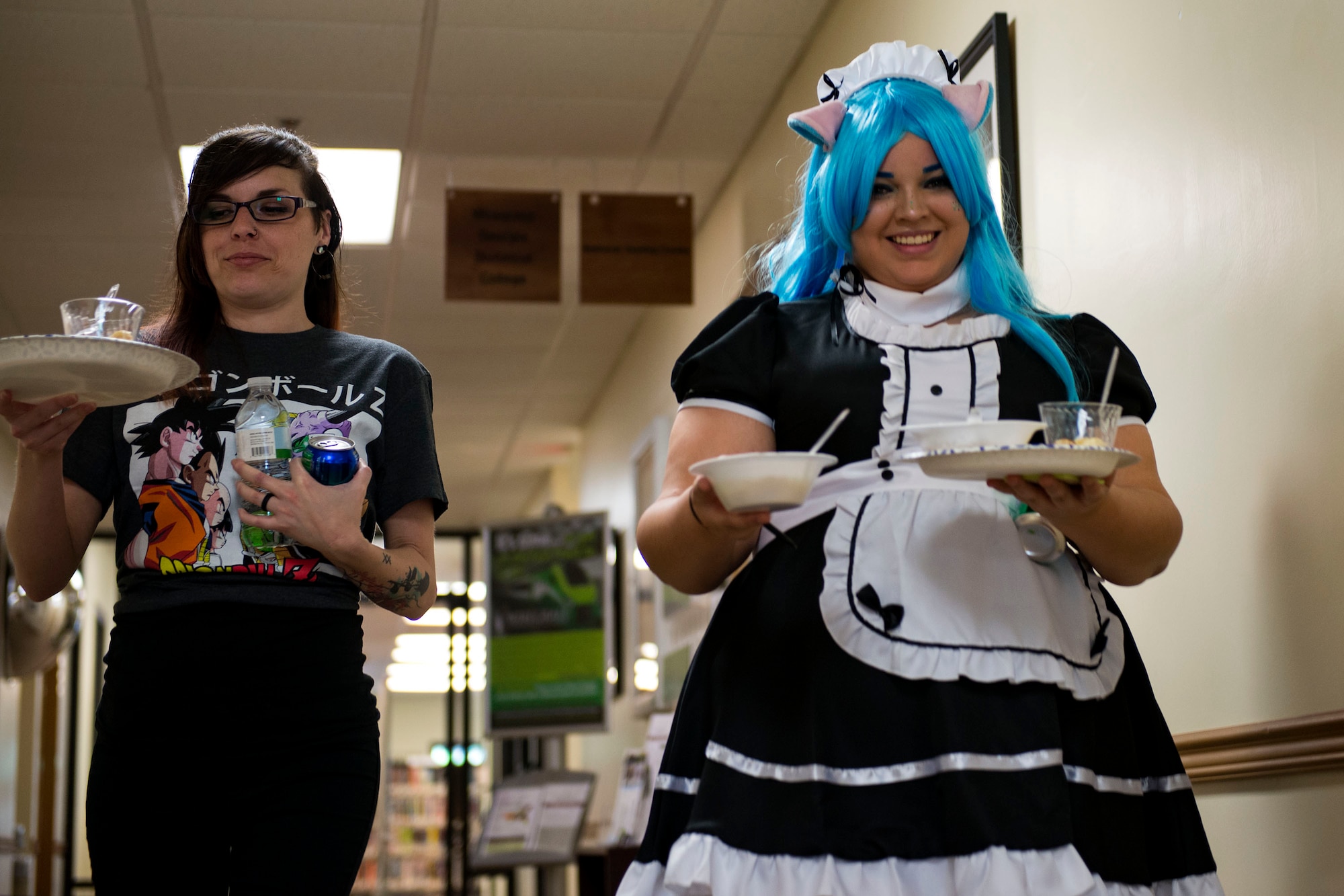 Waitresses bring out food for guests during Cub Con II, a multi-genre entertainment convention, Feb. 23, 2019, at Moody Air Force Base, Ga. At the convention, guests were able to participate in a cosplay contest, an anime music video contest, anime trivia contest and special effects makeup demo. The event served as an opportunity to give Team Moody a chance to experience the anime and comic book culture. (U.S. Air Force photo by Airman 1st Class Erick Requadt)