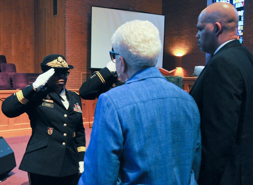 Marla L. Andrews (center), daughter of U.S. Army Air Forces Capt. Lawrence E. Dickson, receives her father’s medals from Brig. Gen. Twanda E. Young, deputy commanding general of the U.S. Army’s Human Resources Command, during a Feb. 24 ceremony held at Fountain Baptist Church in Summit, New Jersey. Dickson was a Tuskegee Airman declared missing in action after his plane crashed in Europe in December 1944. Dickson’s remains were identified in November 2018 using the latest DNA tests, making him the first to be identified out of more than two-dozen Tuskegee Airmen declared MIA during World War II.