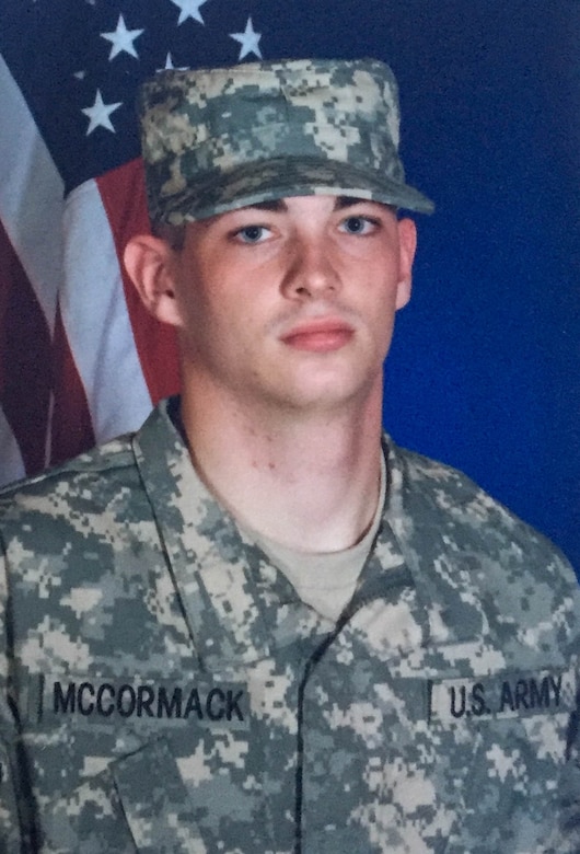 A soldier poses for a portrait photo.