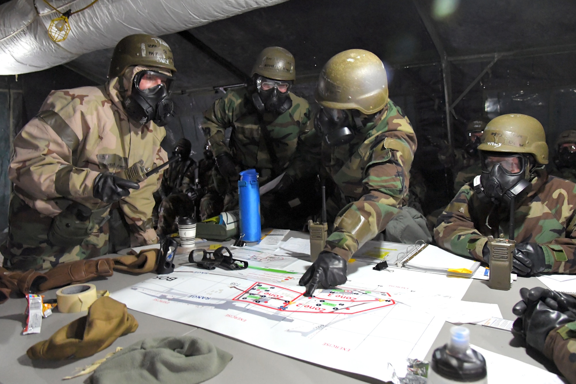 Airmen during a readiness exercise, Feb. 7, 2019, at Hill Air Force Base, Utah. During the exercise, Airmen donned mission-oriented projective posture, or MOPP, gear and were assessed on performing different tasks in a simulated toxic environment to improve their operational readiness. (U.S. Air Force photo by Todd Cromar)