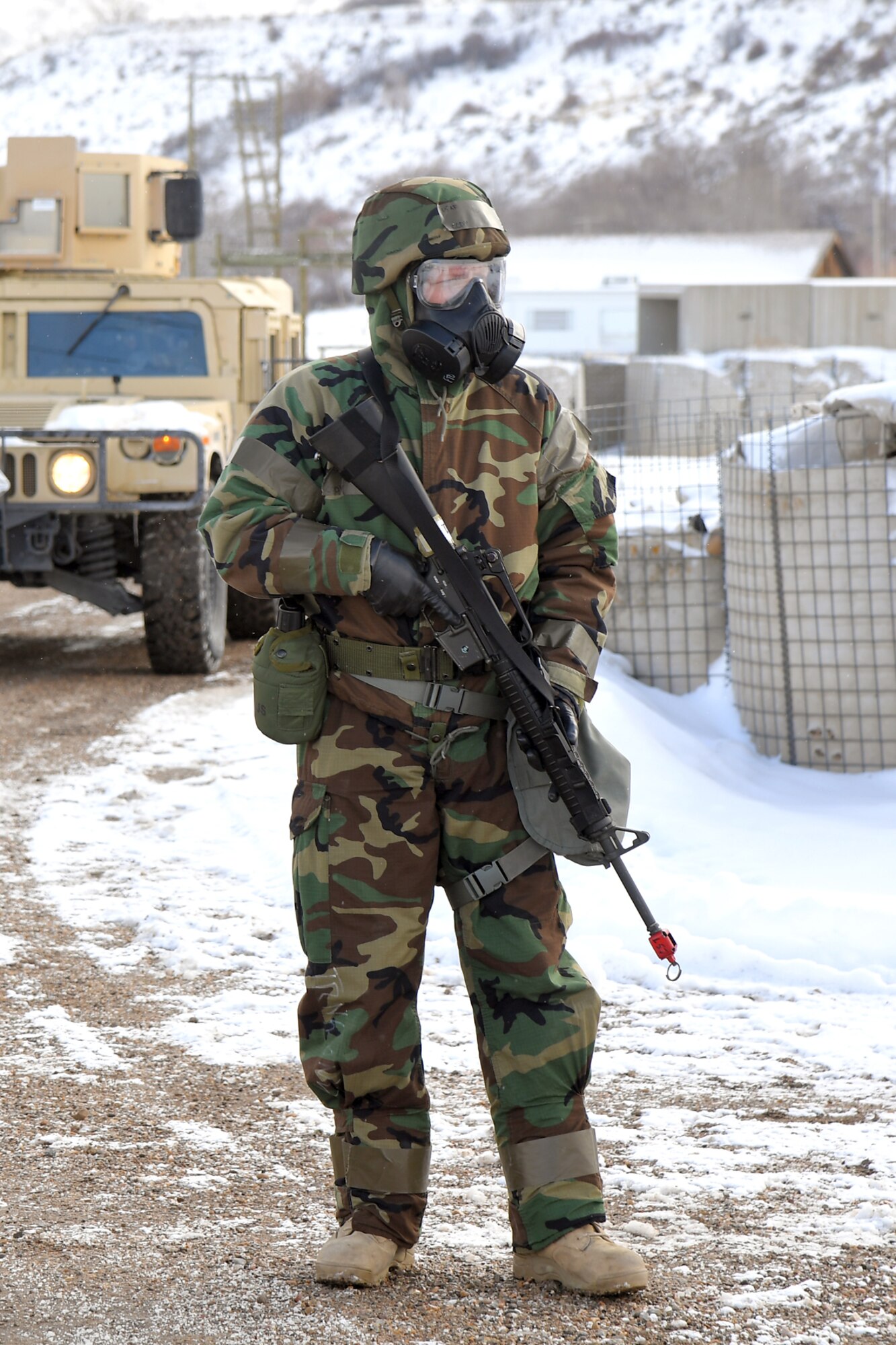 An Airman provides security during a readiness exercise, Feb. 7, 2019, at Hill Air Force Base, Utah. During the exercise, Airmen donned mission-oriented projective posture, or MOPP, gear and were assessed on performing different tasks in a simulated toxic environment to improve their operational readiness. (U.S. Air Force photo by Todd Cromar)