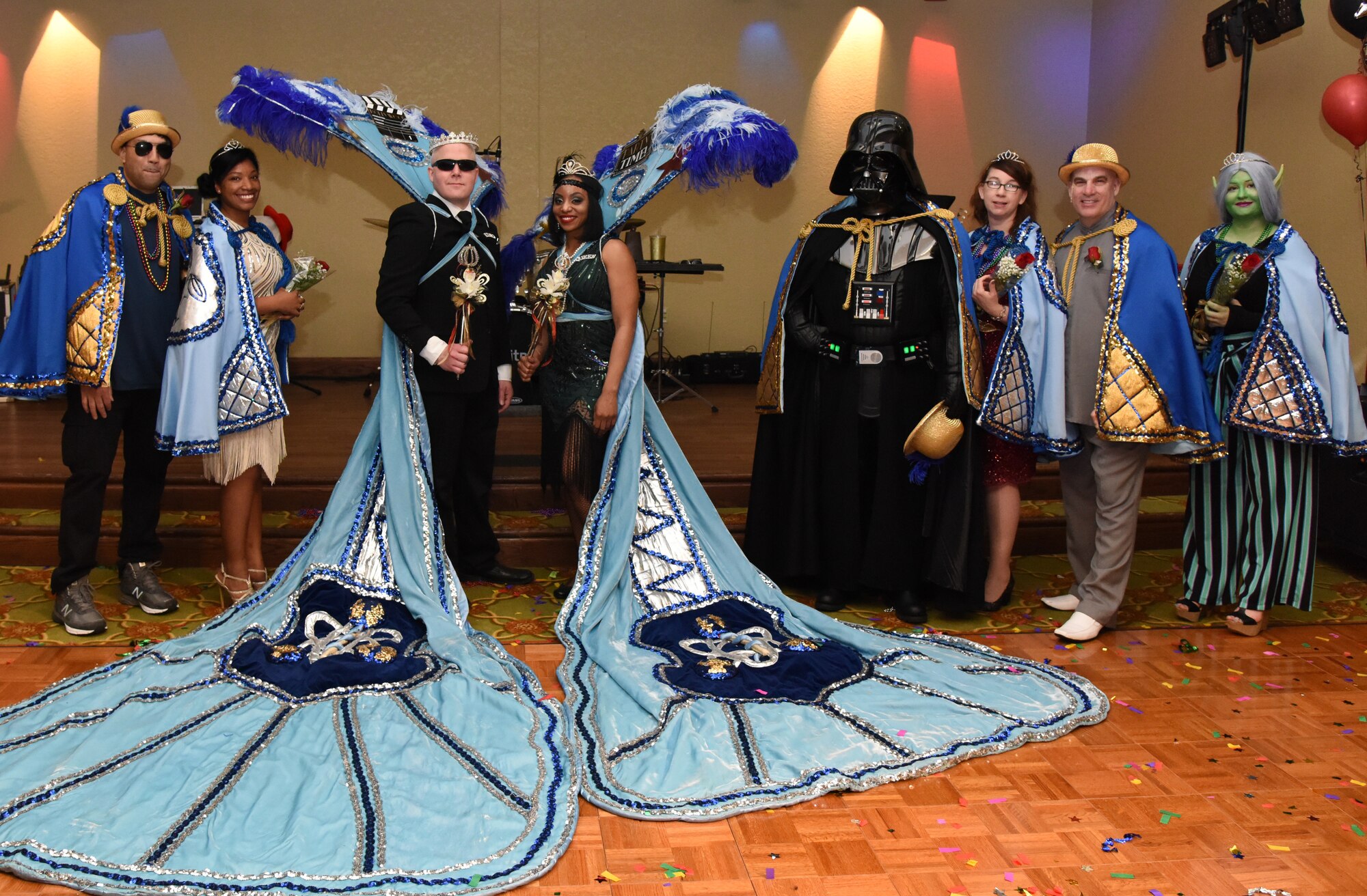The 2019 Krewe of Medics Royalty Court pose for a photo during the 31st Annual Krewe of Medics Mardi Gras Ball at the Bay Breeze Event Center on Keesler Air Force Base, Mississippi, Feb. 23, 2019. The Krewe of Medics hosts a yearly ball to give Keesler Medical Center personnel a taste of the Gulf Coast and an opportunity to experience a traditional Mardi Gras, which is celebrated by the local communities. The theme for this year's ball was Hollywood vs. Broadway. (U.S. Air Force photo by Kemberly Groue)