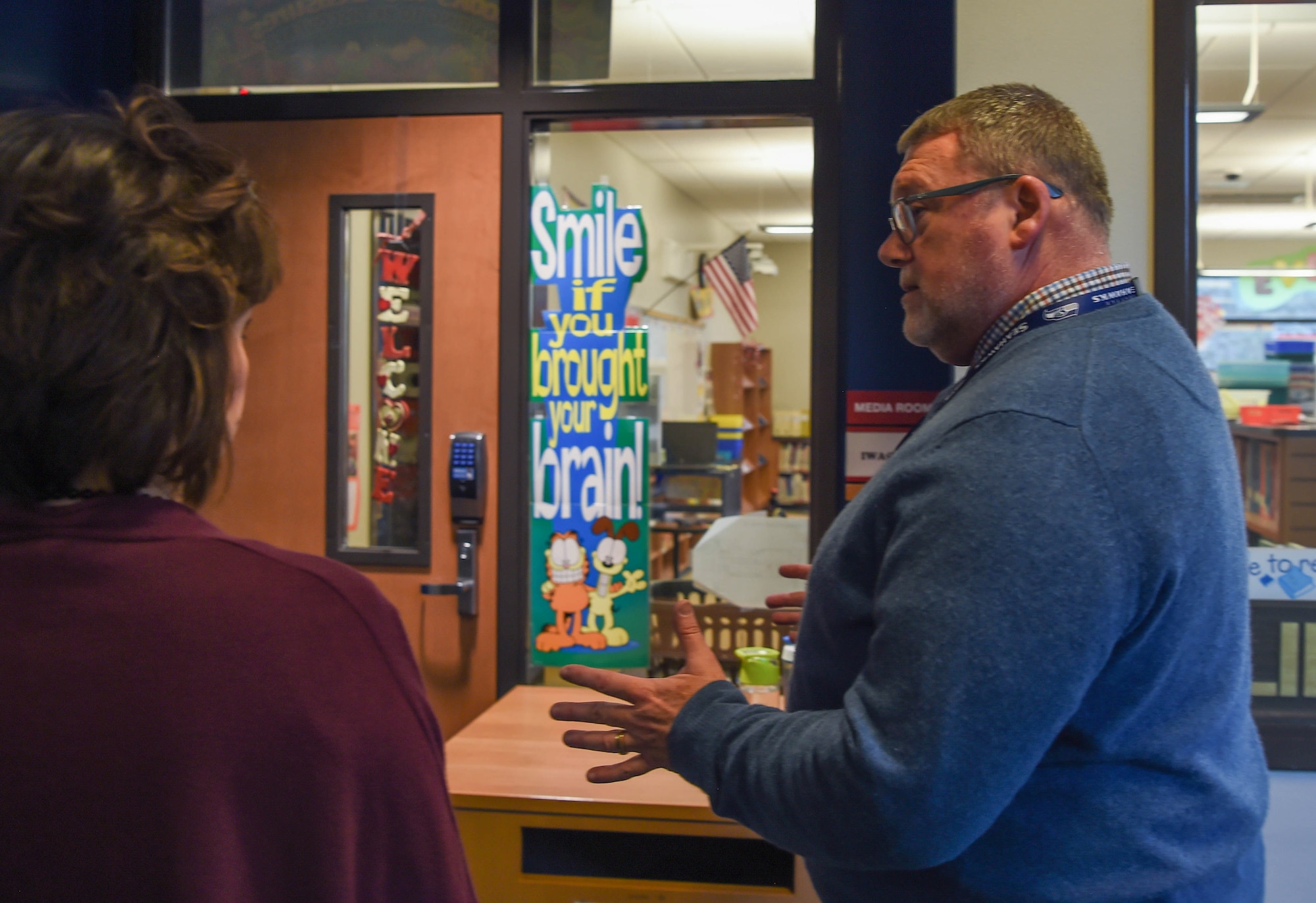 Jeff Murrell, Carter Lake Elementary principal, shares the resources and programs the school’s library offers students during a tour of Joint Base Lewis-McChord (JBLM), Wash., Feb. 20, 2019. This visit to JBLM’s on-base elementary school at McChord Field was one of the points of interest for Kelly Barrett, wife of Maj. Gen. Sam Barrett, 18th Air Force commander. It can sometimes be a challenge for the children of military families to receive a solid education when they have to move so often. (U.S. Air Force photo by Senior Airman Tryphena Mayhugh)