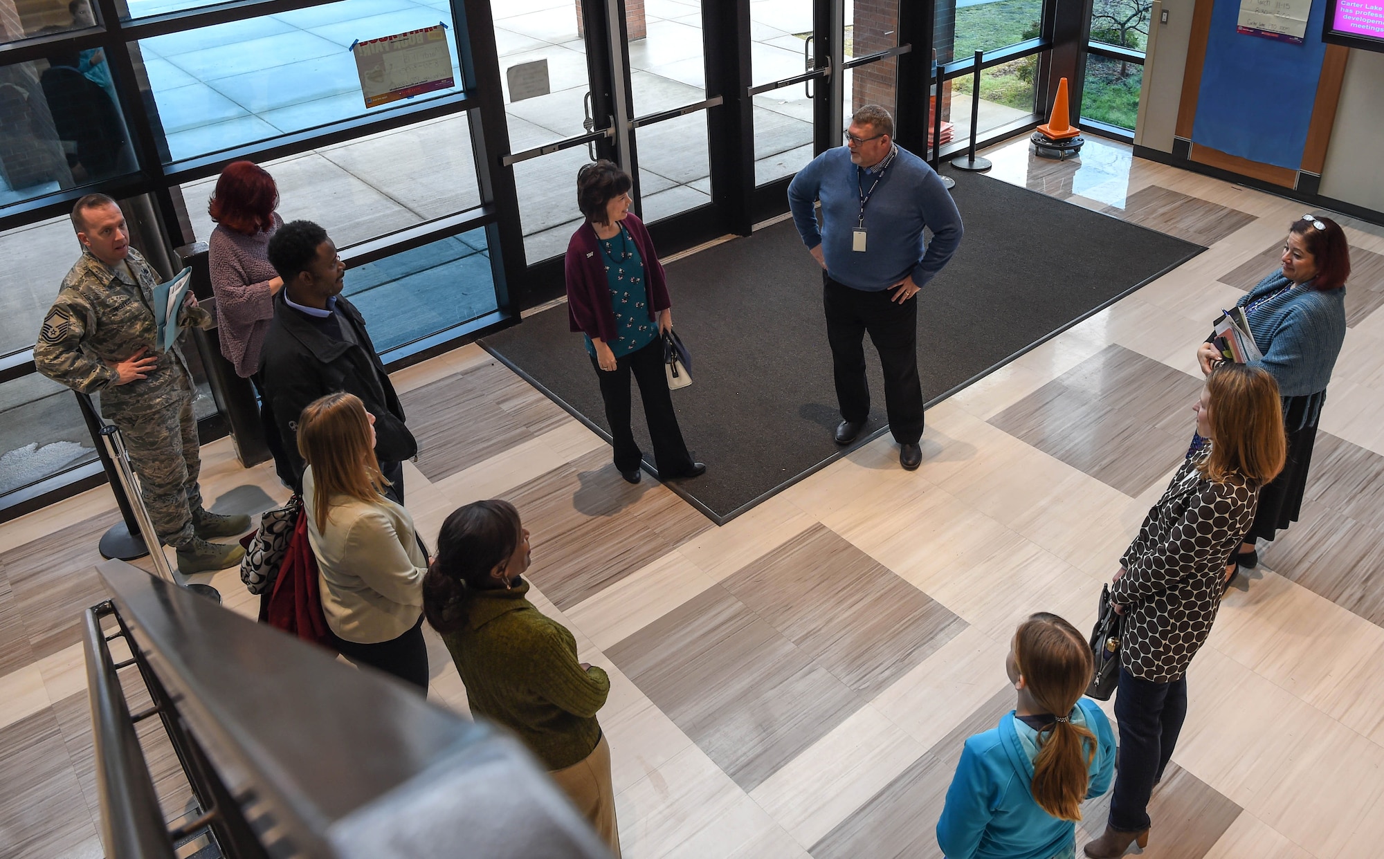 Kelly Barrett, center left, wife of Maj. Gen. Sam Barrett, 18th Air Force commander, shares final thoughts at the conclusion of a tour of Carter Lake Elementary, McChord Field’s on-base school, during her tour of Joint Base Lewis-McChord, Wash., Feb. 20, 2019. Education for children, access to health care, employment for spouses and license reciprocity are some of the challenges faced by military members and their spouses, and championed by Kelly and Air Force leaders. (U.S. Air Force photo by Senior Airman Tryphena Mayhugh)