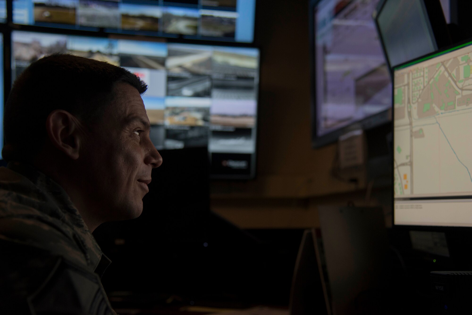 Master Sgt. Aron Luna, 375th Security Forces Squadron logistics superintendent, surveys a map of the base on Feb. 25, 2019 at Scott Air Force Base, Illinois. Once the office space is converted to the Emergency Communications Center, Fire Fighters and Security Forces members, will work side by side in the Emergency Communications Center. (U.S. Air Force Photo by Airman 1st Class Kristin Savage)