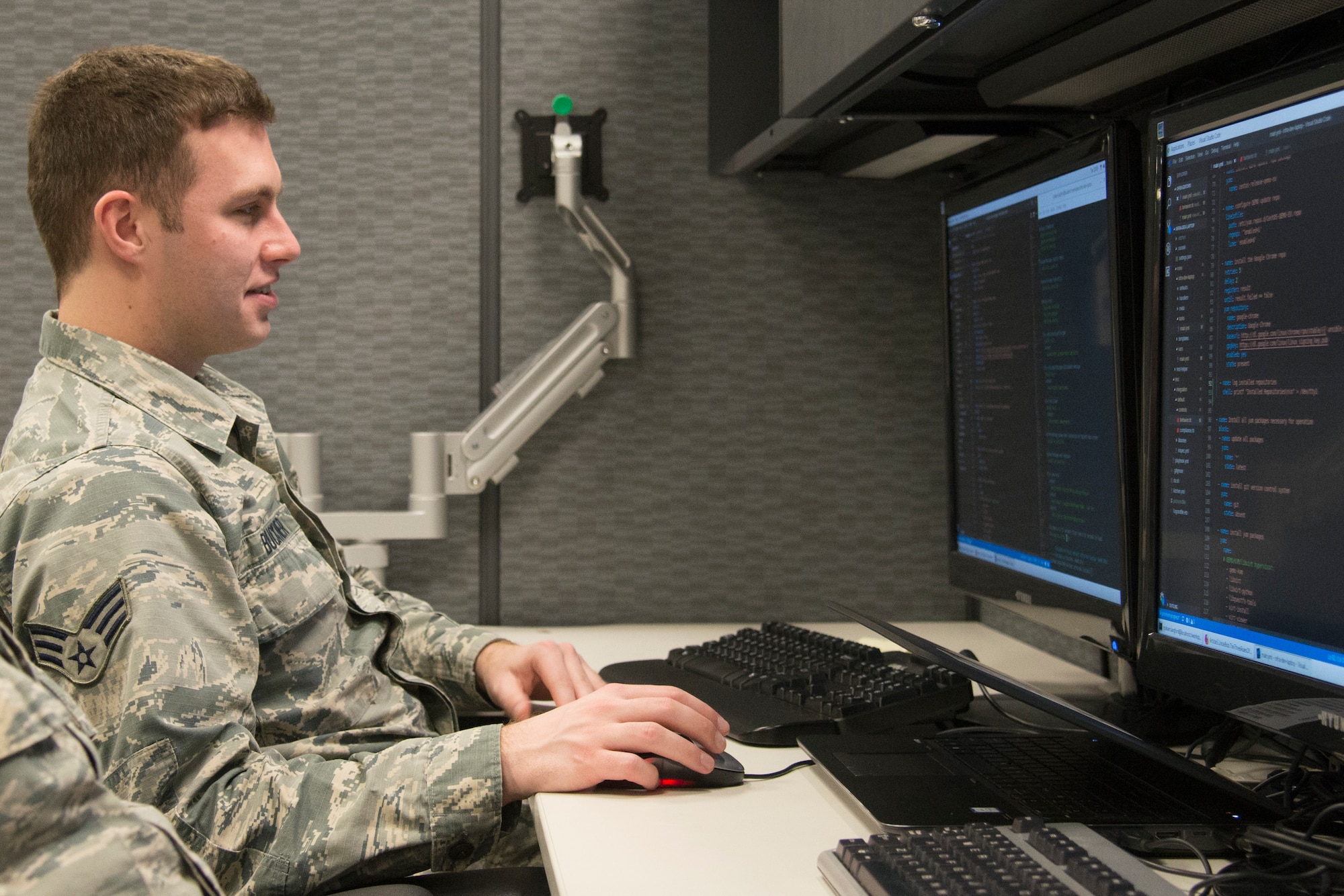 Senior Airman Christopher Buckner, Air Mobility Command application developer, works on a project Feb. 25, 2019 at Scott Air Force Base, Illinois.  When the new office space is completed two Airmen will be able to pair program which allows them to work alongside each other as one enters information and the other performs a quality check. (U.S. Air Force Photo by Airman 1st Class Kristin Savage)