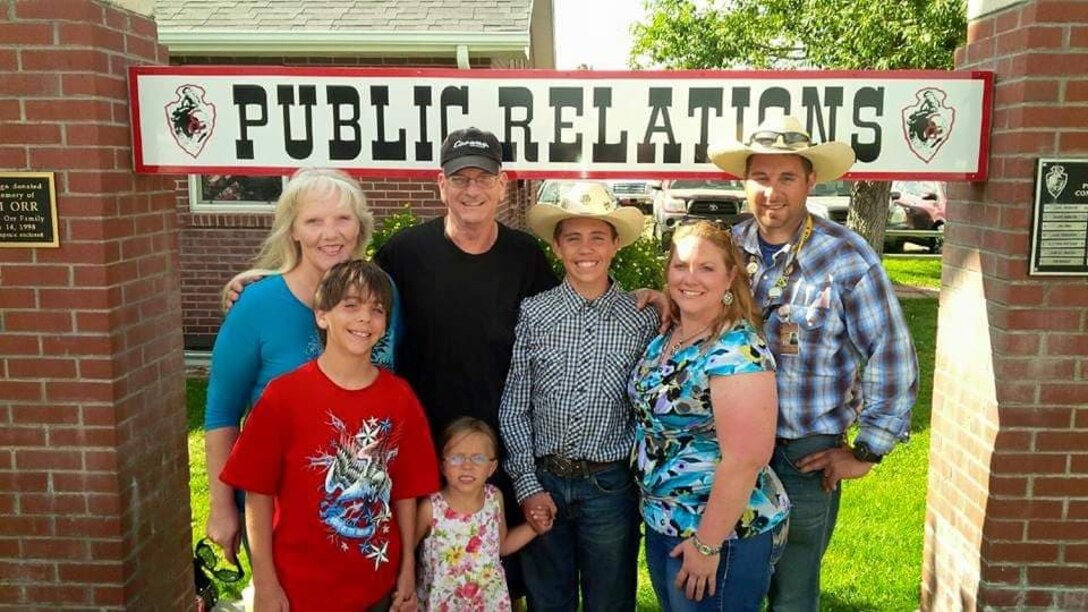 Master Sgt. William Hinchcliff, 31st Security Forces Squadron operations non-commissioned officer in charge, and his father-in-law, retired Tech. Sgt. Keith Zecman, pose for a photo with their family during Cheyenne Frontier Days in Cheyenne, Wyoming, July 21, 2015. (Courtesy photo)