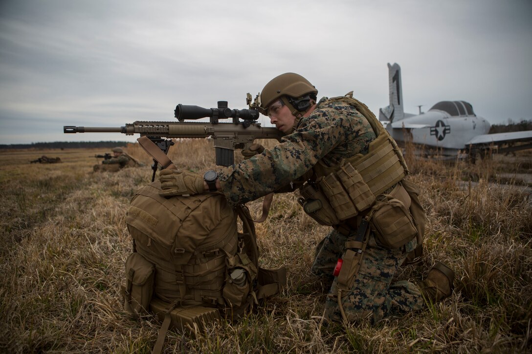 A Marine provides security during a simulated airfield occupation scenario on Camp Lejeune, North Carolina Feb. 19, 2019. The exercise was conducted to certify ground force airfield security procedures as a composited Marine Air- Ground Task Force. The Marine is with 1st Battalion, 8th Marine Regiment, 24th Marine Expeditionary Unit. (U.S. Marine Corps photos by Lance Cpl. Larisa Chavez)
