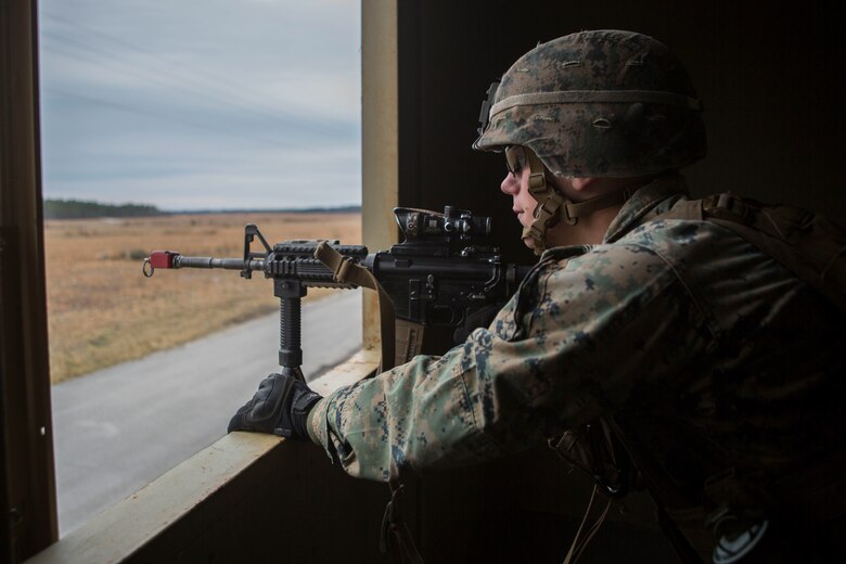A Marine posts security during a simulated airfield occupation and security scenario on Camp Lejeune, North Carolina Feb. 19, 2019. The exercise was conducted to increase ground force response procedures proficiency and enhance security procedures as a composited Marine Air Ground Task Force. The Marine is with 1st Battalion, 8th Marine Regiment. (U.S. Marine Corps photos by Lance Cpl. Larisa Chavez)