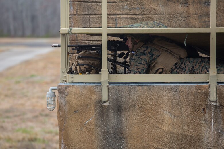 A Marine provides security during a simulated airfield occupation scenario on Camp Lejeune, North Carolina Feb. 19, 2019. The exercise was conducted to increase proficiency and enhance air and ground force response procedures as a composited Marine Air-Ground Task Force. The Marines are with 1st Battalion, 8th Marine Regiment, 24th Marine Expeditionary Unit. (U.S. Marine Corps photos by Lance Cpl. Larisa Chavez)
