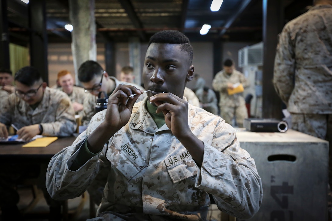 Lance Cpl. Kael M. Joseph, an automatic rifleman with Fleet Anti-terrorism Security Team, Central Command, provides saliva samples required to complete the Salute to Life bone marrow donation registration program. The program was created to encourage service members and their families to register as bone marrow donors.