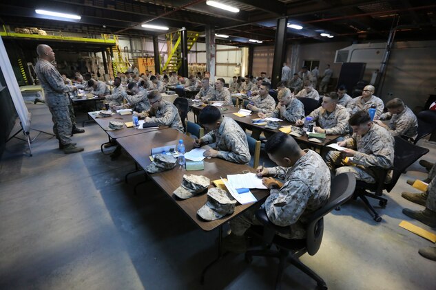 U.S. Marines with Fleet Anti-terrorism Security Team, Central Command, listen to U.S. Navy Lt. Kawika Segundo, a medical officer with Naval Amphibious Force, Task Force 51/5th Marine Expeditionary Brigade, provide instructions to fill out registration forms for the Salute to Life bone marrow donation program. The program was created to encourage service members and their families to register as bone marrow donors.
