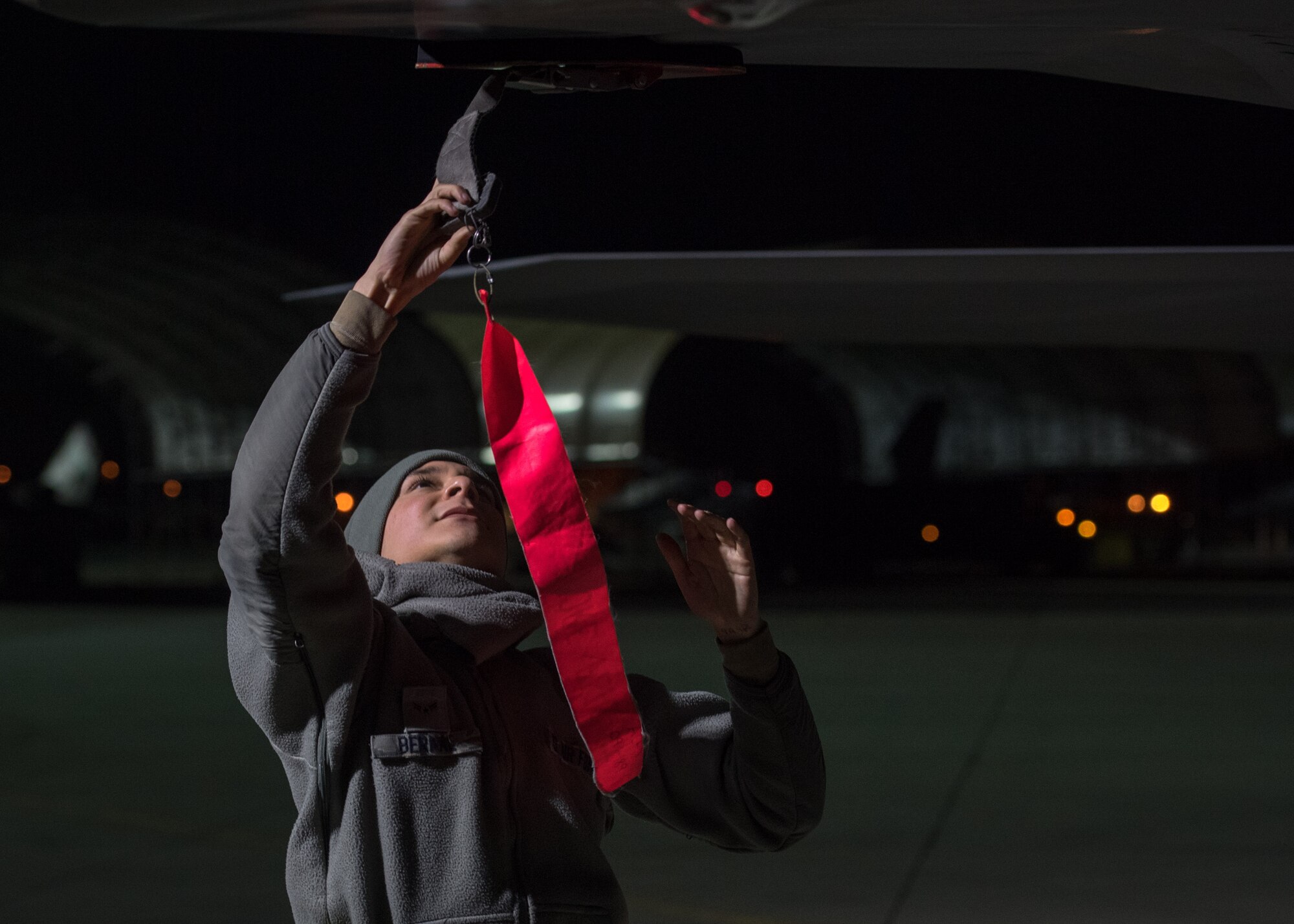 U.S. Air Force Airman 1st Class Alan Bernal, 1st Aircraft Maintenance Squadron assistant dedicated crew chief, performs checks on an F-22 Raptor at Joint Base Langley-Eustis, Virginia, Feb. 21, 2018.
