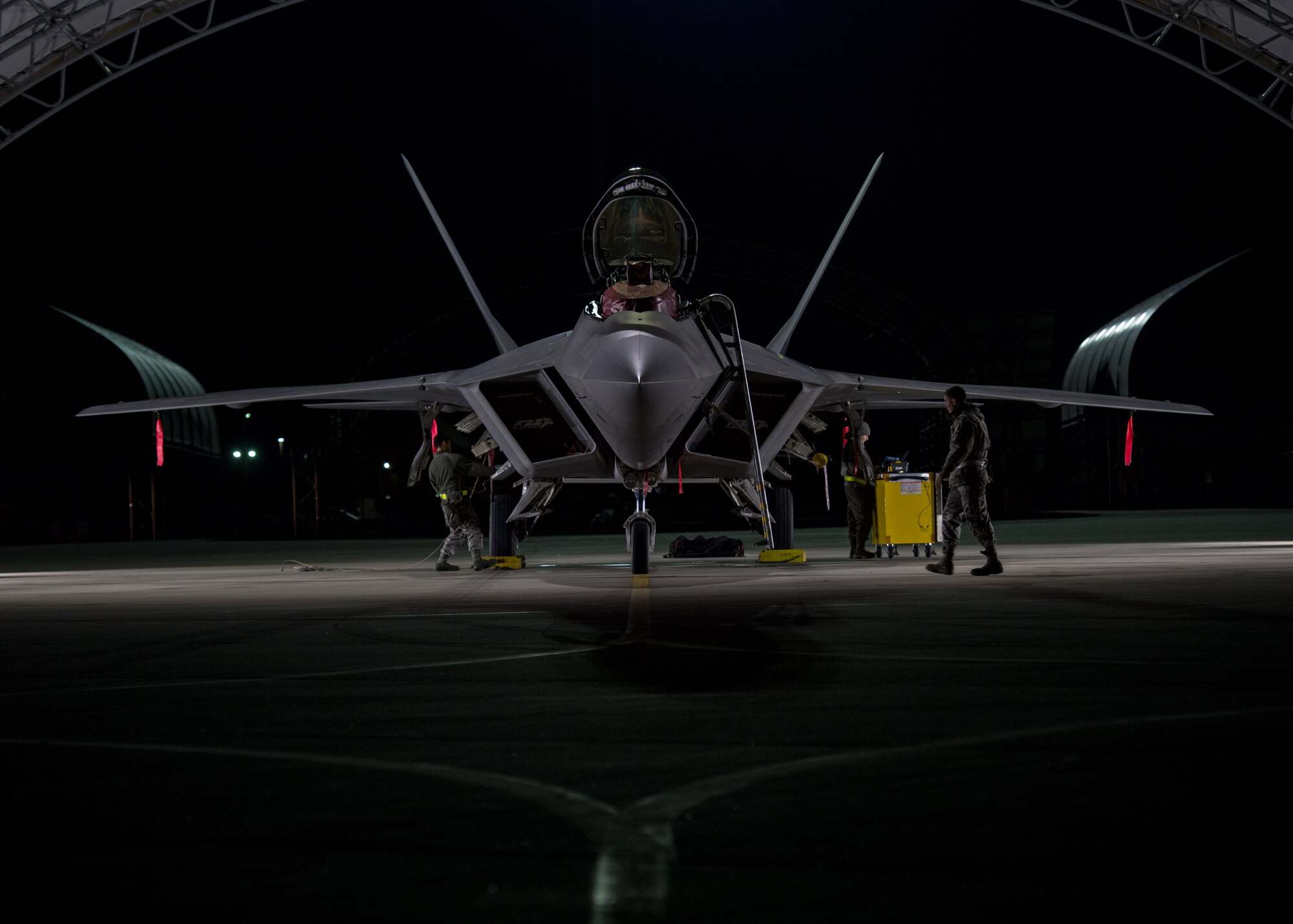 U.S. Air Force Airmen from the 1st Aircraft Maintenance Squadron perform checks on an F-22 Raptor at Joint Base Langley-Eustis, Virginia, Feb. 21, 2018.