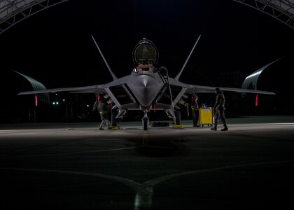 U.S. Air Force Airmen from the 1st Aircraft Maintenance Squadron perform checks on an F-22 Raptor at Joint Base Langley-Eustis, Virginia, Feb. 21, 2018.