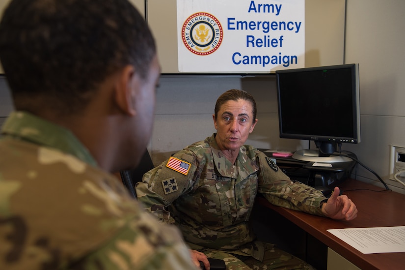 U.S. Army Master Sgt. Tamara Stewart, Joint Base Langley-Eustis Army Emergency Relief coordinator, speaks with a Soldier about the AER program at JBLE, Virginia, Feb. 26, 2018.