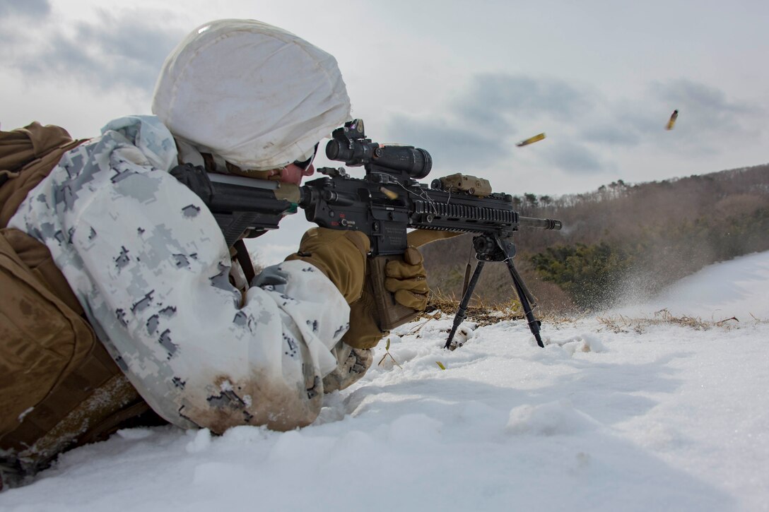 U.S. Marine Corps Lance Cpl. Mitchell Bowen, a rifleman with 1st Battalion, 3rd Marine Regiment, 3rd Marine Division, fires at targets during a live-fire drill, in the Ojojihara Maneuver Area, Miyagi Prefecture, Japan, Feb. 15, 2019.