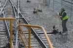 Thomas DeRosier, 733rd Logistics Readiness Squadron, Transportation section, utility rail branch locomotive engineer, operates a switch on a rail line at Joint Base Langley-Eustis, Virginia, Feb. 15, 2019. The U.S. Army closed the military occupation specialty to active duty and now only has Army Reserve and civilian railway operations crewmembers. (U.S. Air Force photo by Senior Airman Derek Seifert)