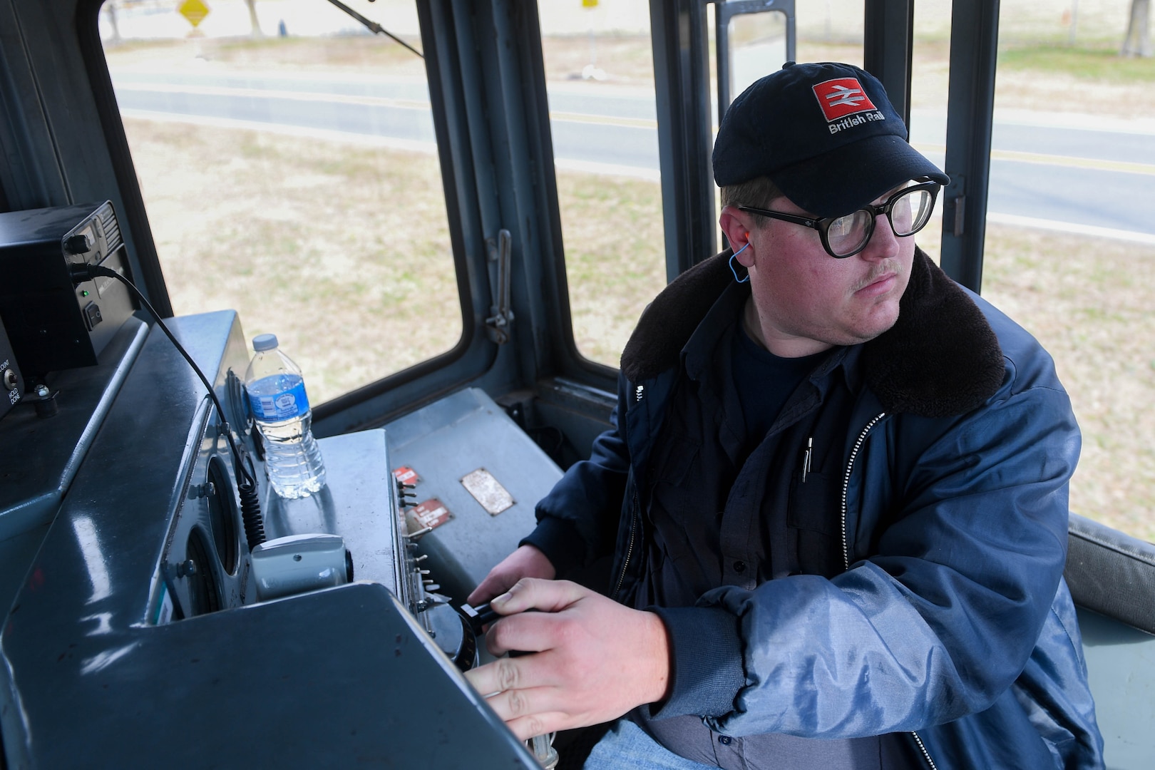 William Grimes, 733rd Logistics Readiness Squadron, Transportation section, utility rail branch locomotive engineer, steers a railcar at Joint Base Langley-Eustis, Virginia, Feb. 15, 2019. The JBLE utility shop plays an integral role in Joint Logistical over the Sea operations where causeways, vehicles and equipment can easily be transported across the nation.(U.S. Air Force photo by Senior Airman Derek Seifert)