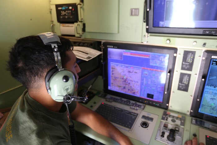 Cpl. Freddy D. Calderon, an unmanned aircraft systems operators with Marine Unmanned Aerial Vehicle Squadron 4, 4th Marine Aircraft Wing, Marine Forces Reserve, sets the flight path for an RQ-7 Shadow to perform reconnaissance at Camp Wilson, Marine Air Ground Combat Center, 29 Palms, California, June 22, 2017 during Integrated Training Exercise 4-17. The Marines conducted reconnaissance missions in support of the 2nd Battalion, 25th Marine Regiment, 4th Marine Division, MARFORRES, final battalion exercise of ITX 4-17. (U.S. Marine Corps photo by Lance Cpl. Stanley Moy)